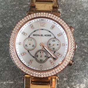Michael Kors rose gold watch.